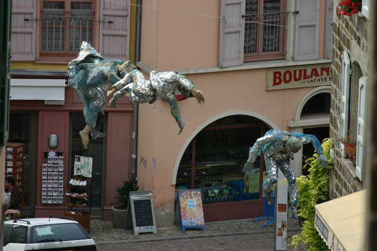 Sponge figures hanging across the street