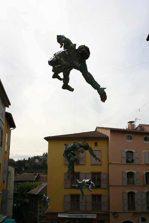 Sponge figures hanging across the street